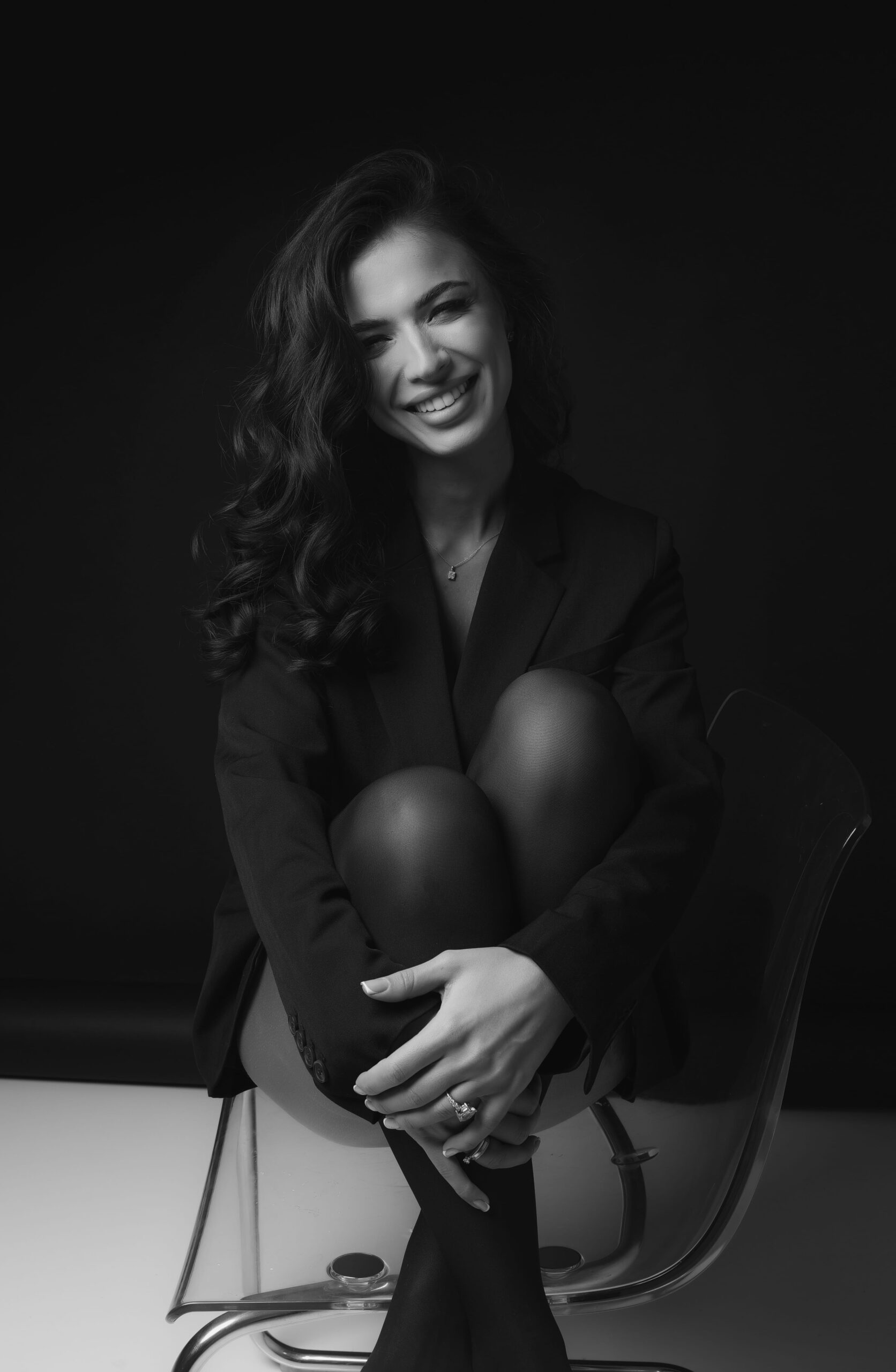 An intimate black and white studio portrait