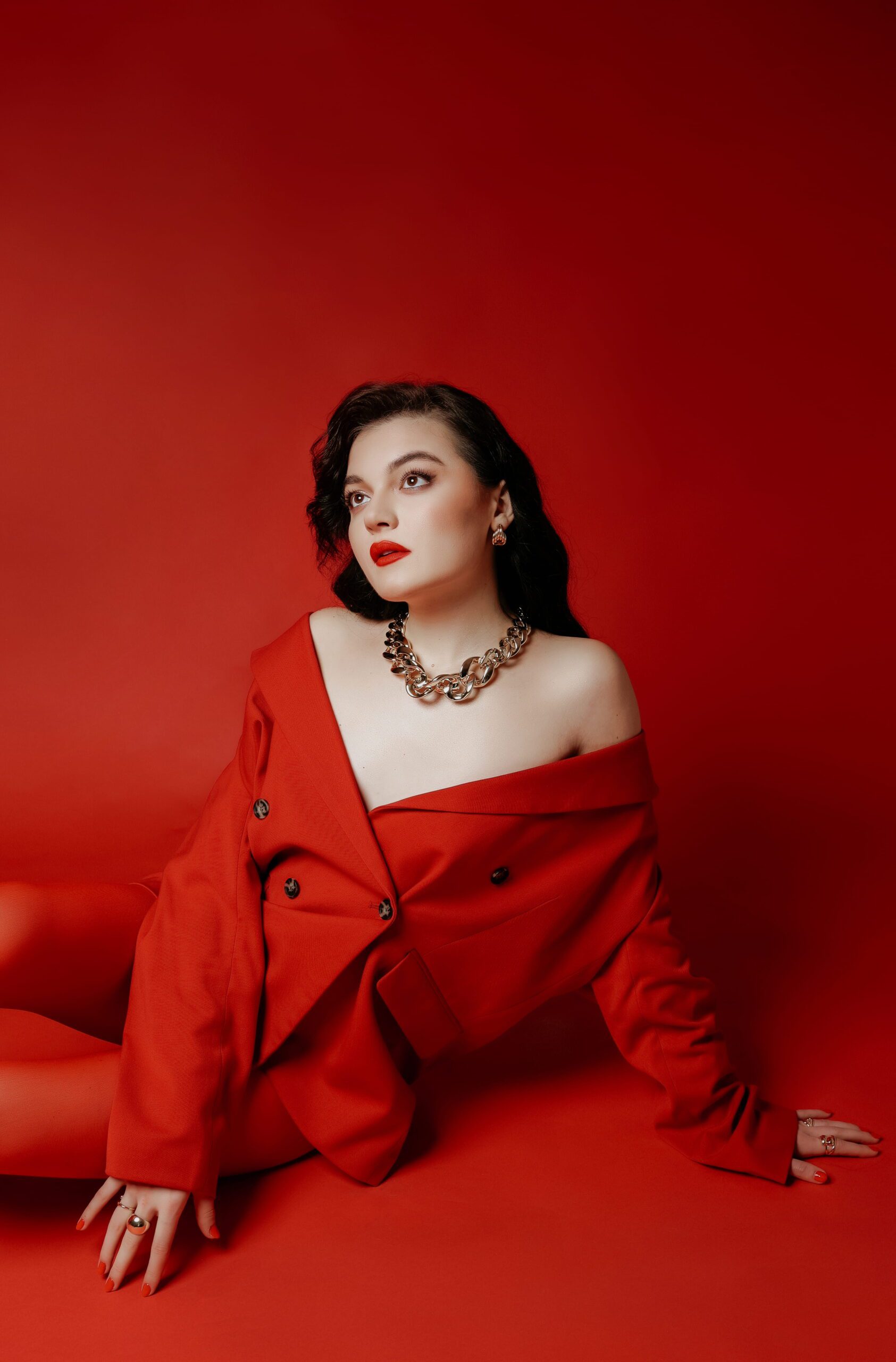 A close portrait of a woman in red