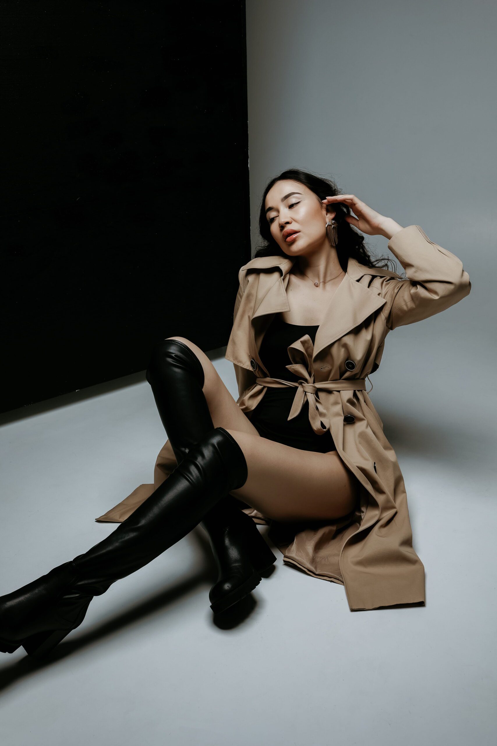 A woman stretching her legs from a studio chair